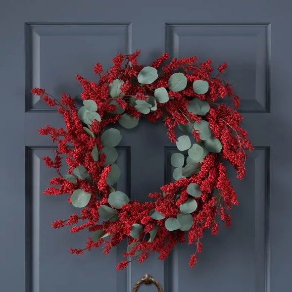 Outdoor artificial Christmas wreath with eucalyptus leaves and red berries